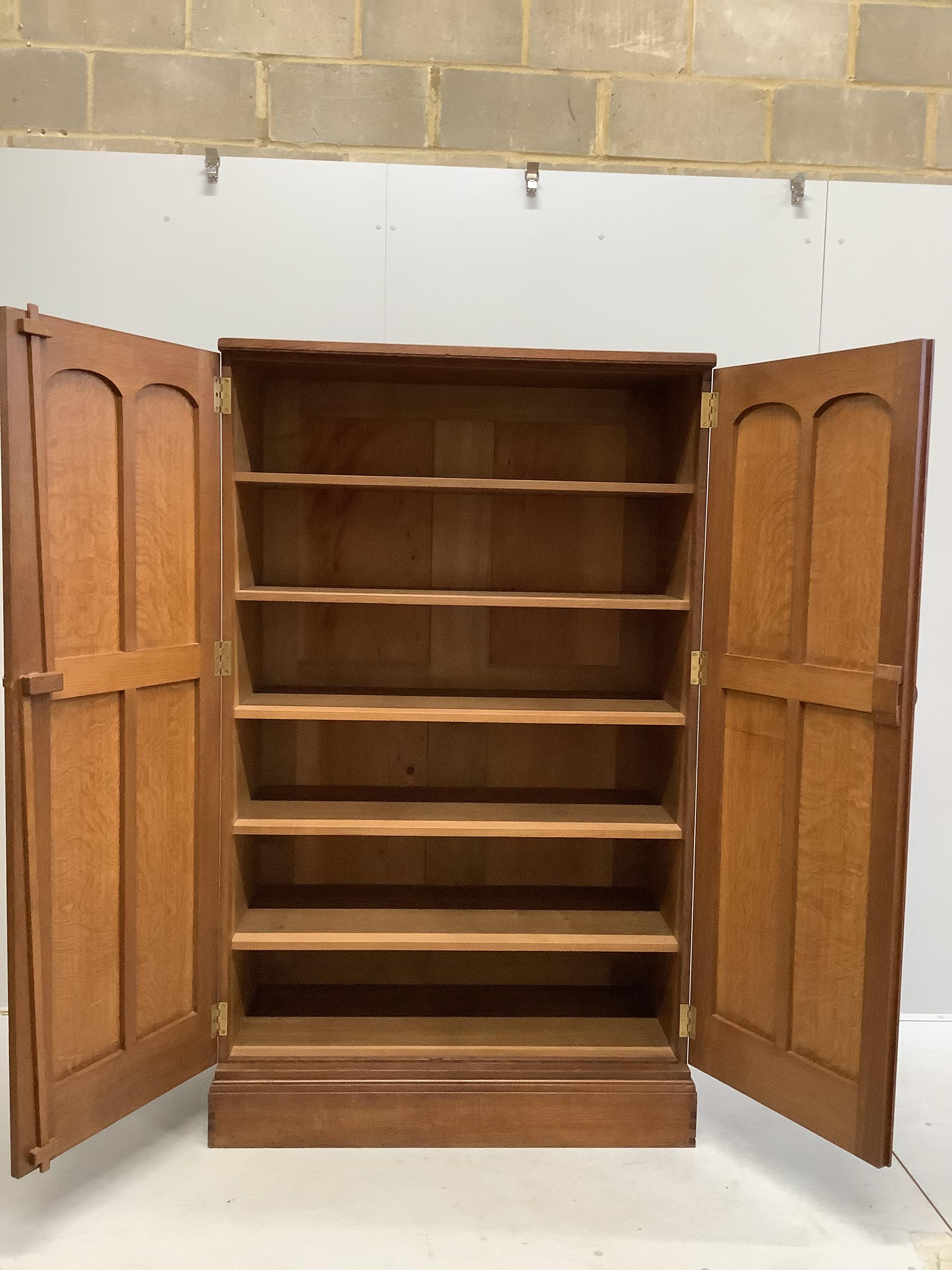 Stanley Webb Davies (1894-1978), an Arts & Crafts oak press cupboard, interior with makers cypher and dated 1951, width 107cm, depth 51cm, height 177cm